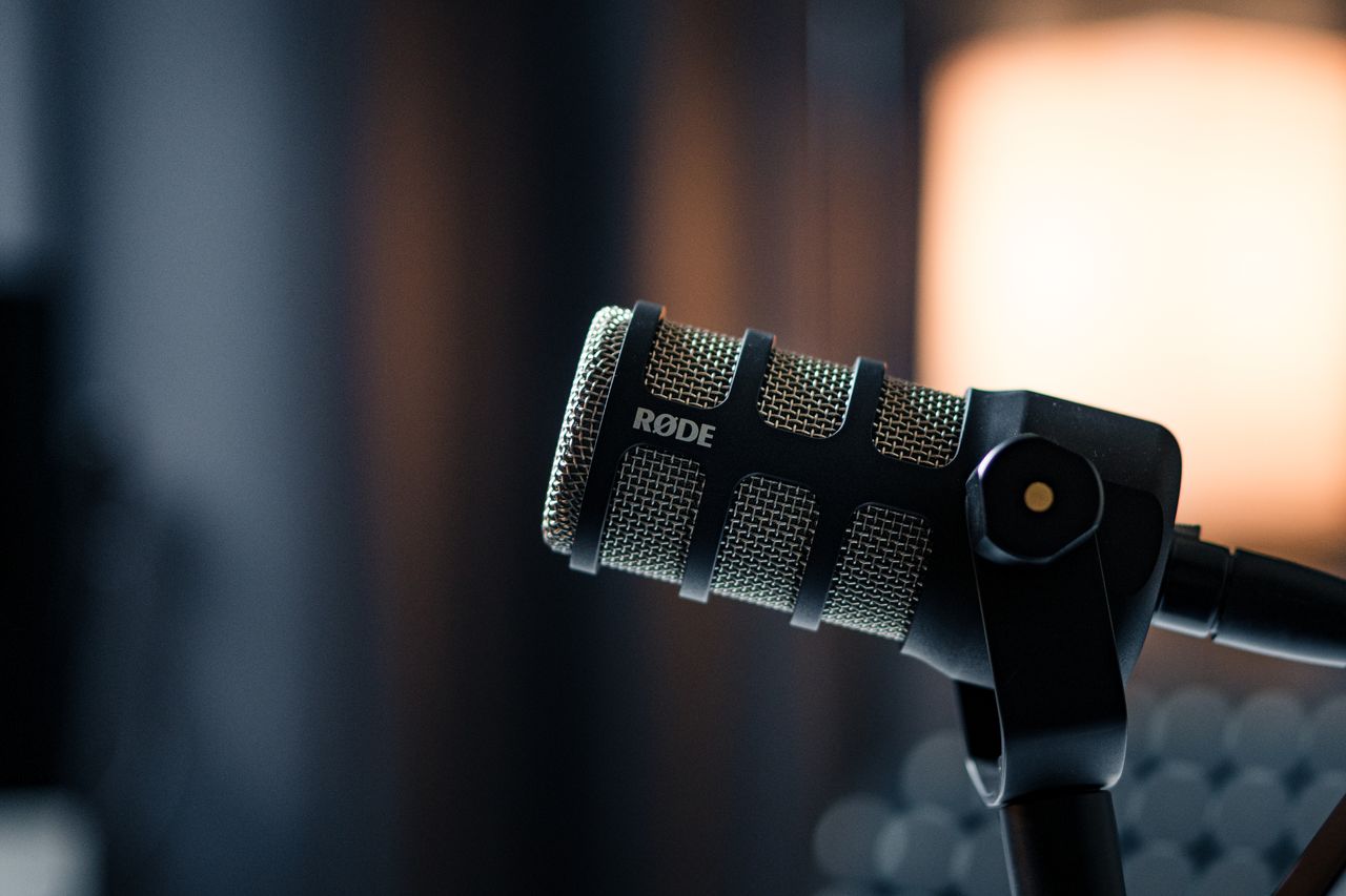 services-03 Close-up of a Rode microphone in a studio, emphasizing professional audio equipment.